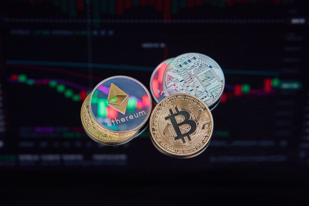 Why STRC Suddenly Collapsed — What Every Investor Needs to Understand Floating Bitcoin and Ethereum coins with a market trend chart in the background symbolizing digital finance.
